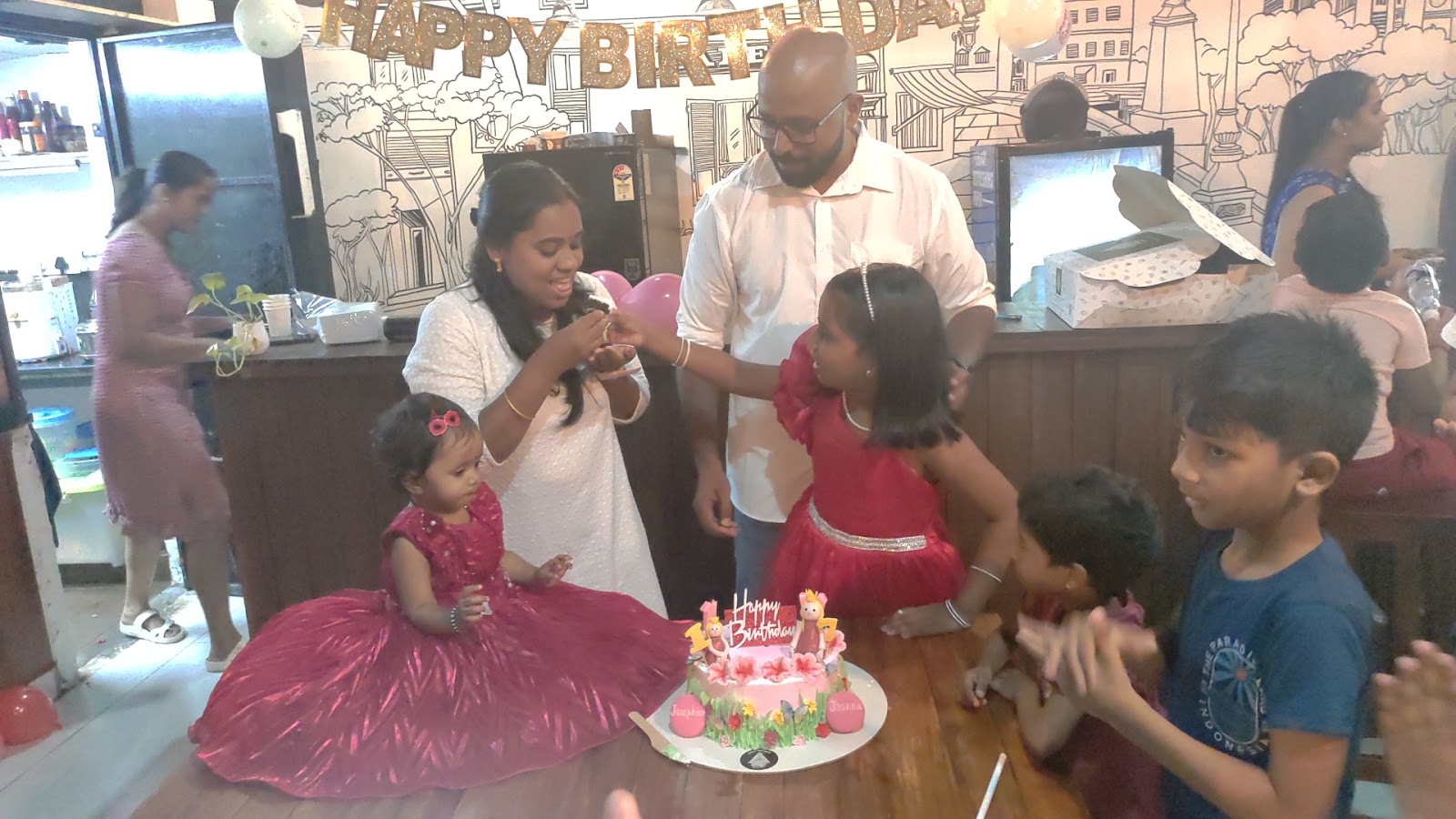 A family sharing cake at Forwords